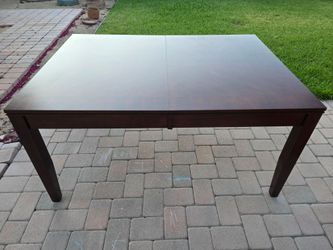 Dark wood dining table, 60 to" x 42", extendable to 78" x 42".