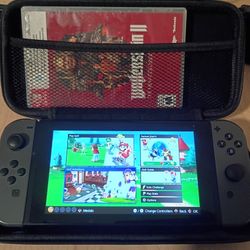 Nintendo Switch V2 grey w/ case and two games 