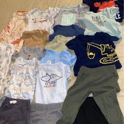 Box Full Of Baby Boy Clothes And Baby Arm Pillow 