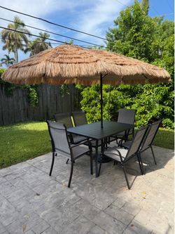 Patio set with 6 chairs and large umbrella