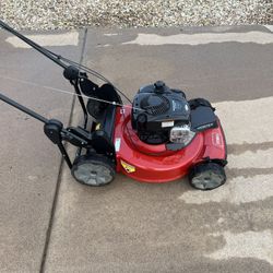 Gasoline Toro Lawn Mower, Seeder, and Gas With Gas Tank