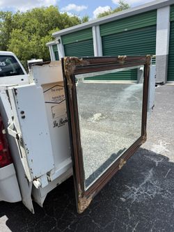 Carved Wood Frame Mirror .