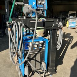 Miller dimension 650 with wire feeder and mig cart runner