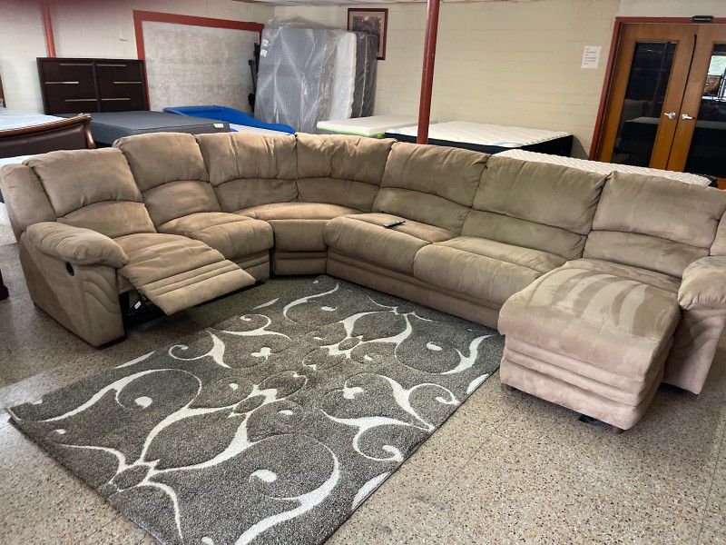 Tan Colored Sectional w/ Recliner, Chaise Lounger & Pull-out Bed