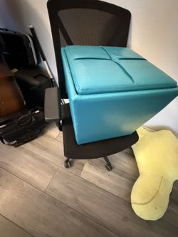 teal faux leather storage ottoman cube features a partitioned, cushioned flip-top lid