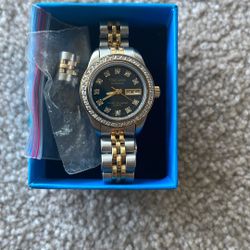 Elegant Oleg Cassini Two-Tone Women's Watch with Crystal Bezel and Day/Date Display 