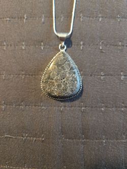 Silver necklace with black fossil coral gemstone pendant