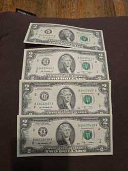 Two dollar bill with ink stain