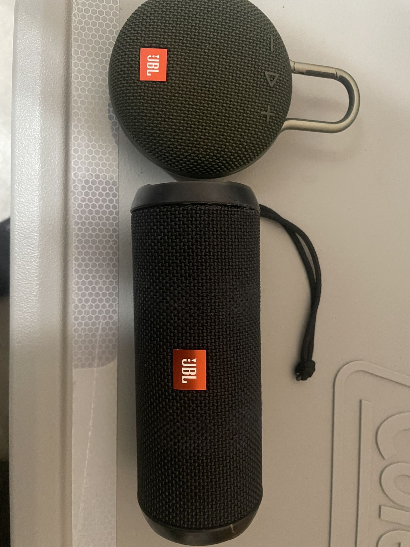 Two JBL Bluetooth speakers