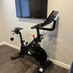 Peloton Bike - Brand New Condition - Includes: Shoes, Mat, & Tons Of Brand New Accessories 