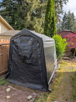 6' x 8' black outdoor storage shelter