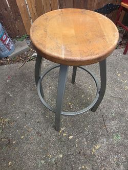 Sturdy metal stool with wooden seat