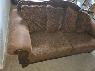 Traditional couch with Carved Wood Frame.