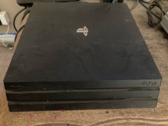 PlayStation 4 Pro console with 3 games