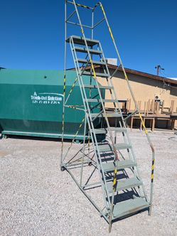 $350 rolling stairs stock ladder 10 ft high at top step
