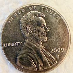 2009 D White Lincoln Bicentennial Penny. Lincoln Sitting In log.