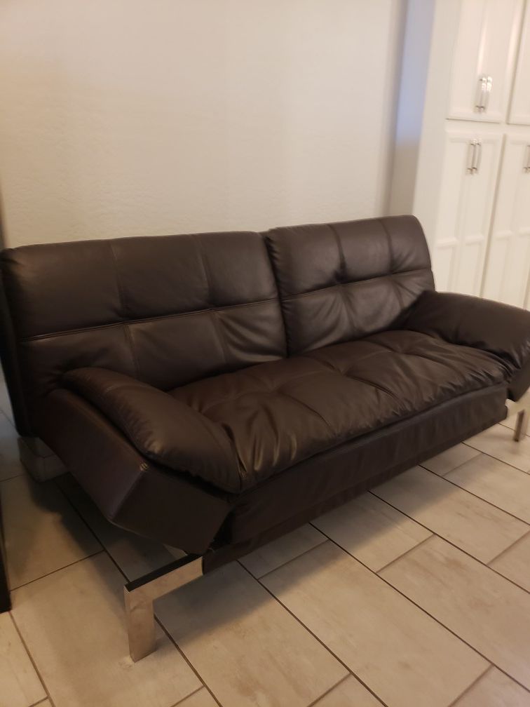 If you see it. It's available. Large brown leather Futon Must sell
