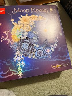 JIESTAR Moon Flower building block set (Model JJ9094), featuring a crescent moon and blue botanical floral display designed for home wall decor.