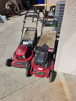 Two Toro Gas Push Lawn Mowers