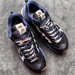 The purple Nike shoes designed by the designer