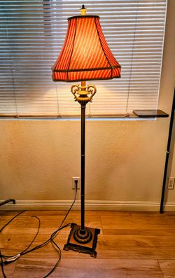 Vintage standing copper lamp. 50 inches tall.