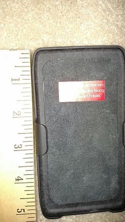 Phone holster holds older iPhone.