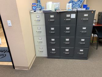 Two 4 drawer filing cabinets for sale. Must pick up from Southern Highlands office. $75.