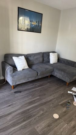 Grey Corduroy L-Shaped Sectional Sofa with pillows