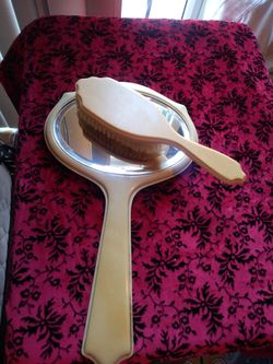 Vintage Bakelite Celluloid brush and mirror.