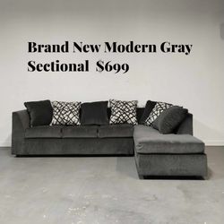 🛋️ Brand New Modern Gray Sectional – $650  Stylish and comfortable L-shape design perfect for any living room. ✅ Brand new condition ✅ Soft gray fabr