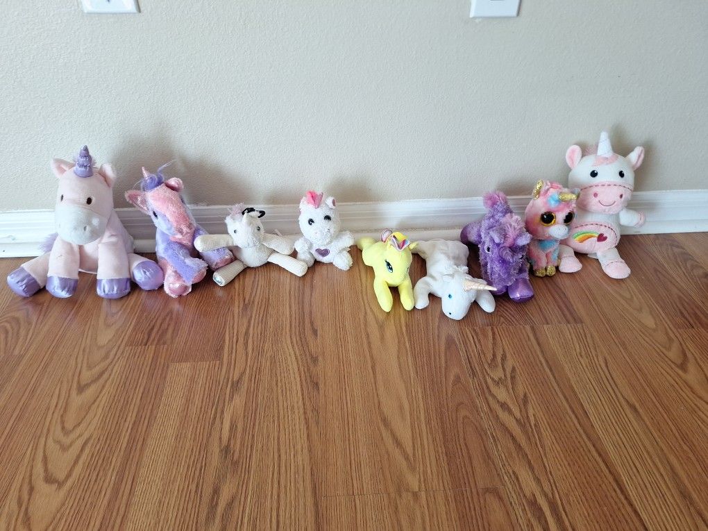 9 Small Stuffed Unicorns