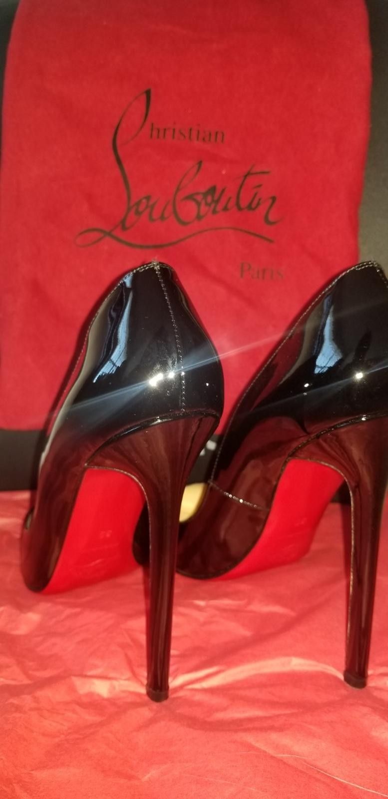 Christian Louboutin heels (Black Red Bottoms)