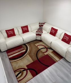 Beautiful 5-Piece Power Reclining leather sectional sofa. White color. Delivery available for an additional cost.