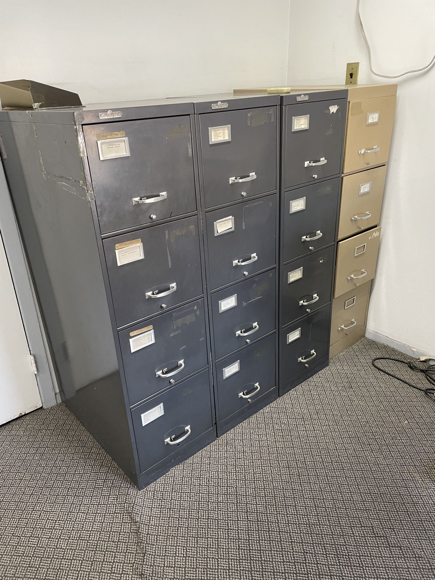4 tall file cabinets 