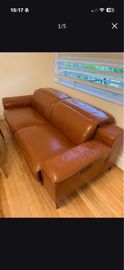 Power reclining natuzzi leather couch