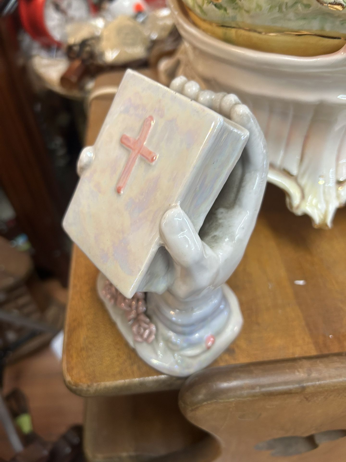Ceramic Figurine of Praying Hands Holding a Bible