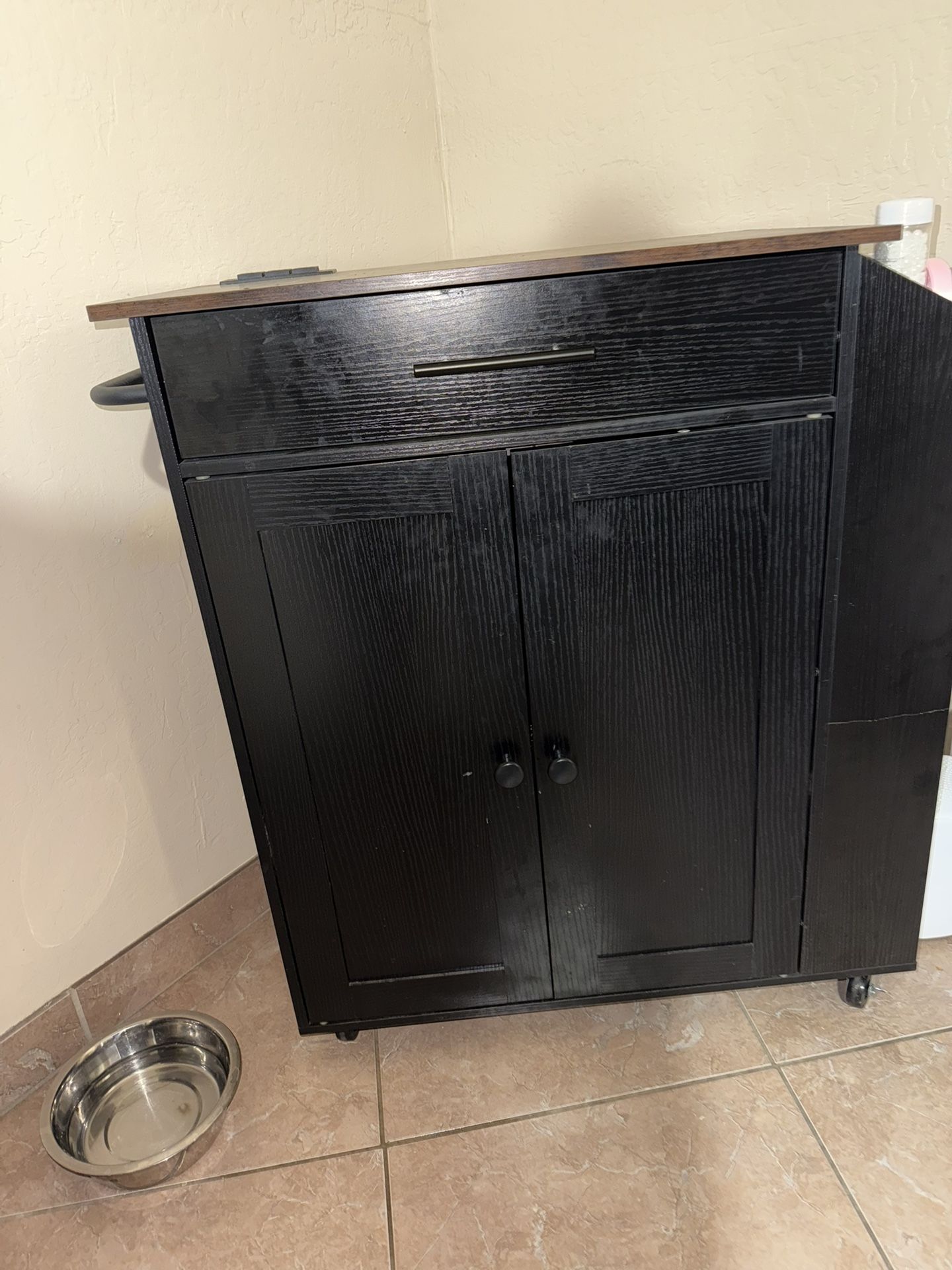 Dark brown kitchen cabinet with charging station