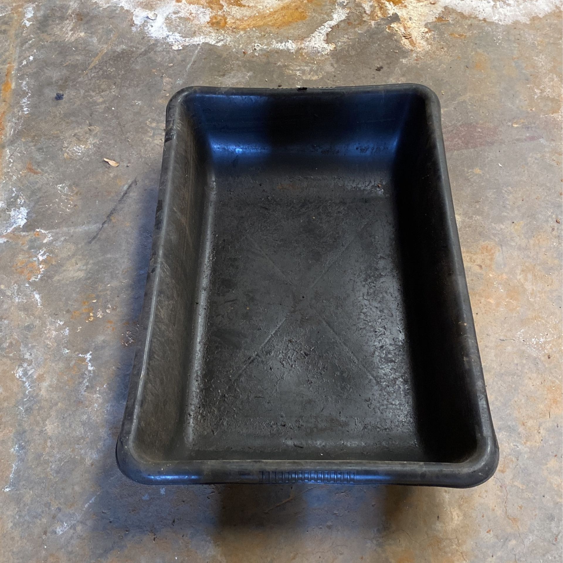 Plastic black tub approximately 2’ x 3’ used for making cement or catching oil or whatever