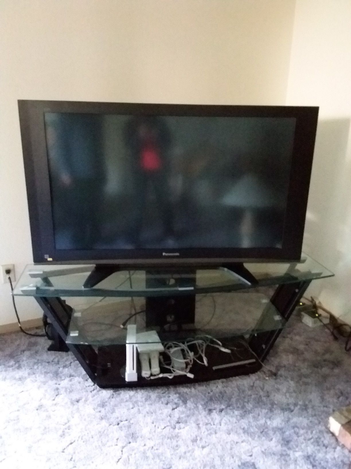 Panasonic tv with stand and a vii system with an extra golf cd
