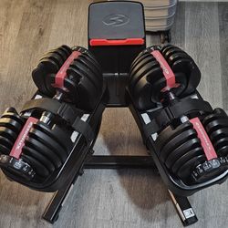BOWFLEX DUMBELLS ADJUSTABLE WITH STAN