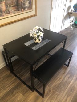 Like new black dining table set with 2 benches