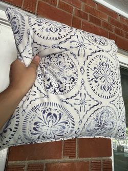 White and blue outdoor patio furniture pillow