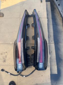 2016 Escalade OEM tail lights in great shape and works perfect. Passenger light has a light scratch but can be buffed off 400 for both 250$ea 30 day w