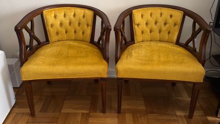 Pair of yellow barrel chairs