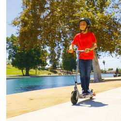 Razor Black Label E100 Electric Scooter - Silver / Red, for Kids Ages 8+ and up to 120 Ibs, 8" Pneumatic Front Tire, Up to 10 mph & up to 35 mins of R