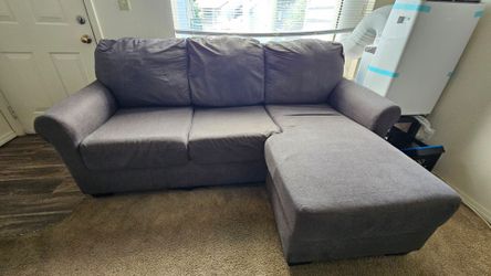 Reversible Chaise Sectional with Coffee table, 2 side tables, and 2 lamps.