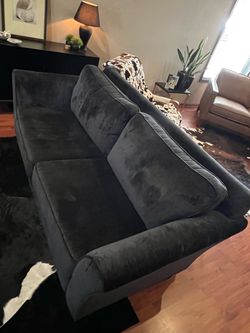Like new dark charcoal couch almost black in color