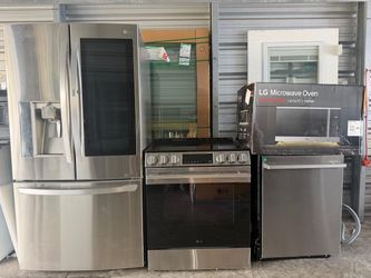 Full kitchen appliance set stainless steel LG stove, refrigerator with 3 doors, microwave, dishwasher.
