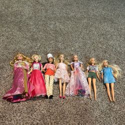 7 Barbie Dolls