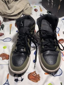 The color is green and black and white boys shoes